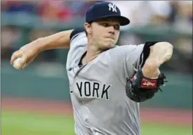  ?? DAVID DEMER — THE ASSOCIATED PRESS ?? New York Yankees starting pitcher Sonny Gray delivers in the first inning against the Cleveland Indians Thursday in Cleveland. Gray lost his Yankees’ debut 5-1.