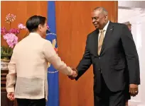  ?? ?? US Secretary of Defence Lloyd James Austin, right, shakes hands with Philippine President Ferdinand Marcos during a courtesy call at Malacanang Palace in Manila, Philippine­s, on Thursday. — ap