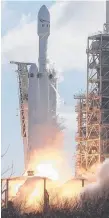  ??  ?? The SpaceX Falcon Heavy rocket lifts off from its launch pad yesterday.