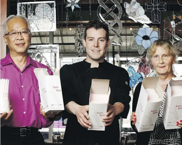  ?? IAN KUCERAK ?? Hong Vu, left, Adam Stoyko and Kim Franklin hold boxes of straws they will return as Edmonton’s Highlevel Diner eliminates the drinking tool in an attempt to cut down on plastic waste. There will still be compostabl­e straws for people who need them.