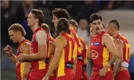  ?? EDITORIAL USE ONLY Photograph: Scott Barbour/AAP ?? The Suns leave the field after losing the Round 5 AFL match between the Western Bulldogs and Gold Coast Suns at Marvel Stadium, Melbourne, Saturday, April 17, 2021. (AAP Image/ Scott Barbour) NO ARCHIVING,