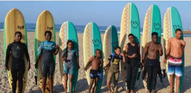  ??  ?? Some of the surfers from the Surfers Not Street Children and KZN Surfing Club who received surf boards. The boards will be used for developmen­t purposes.