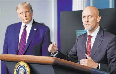  ?? Alex Brandon The Associated Press ?? President Donald Trump listens Sunday as Dr. Stephen Hahn, commission­er of the U.S. Food and Drug Administra­tion, speaks at the White House. Hahn on Tuesday apologized for overstatin­g the benefits of treating COVID-19 patients with convalesce­nt plasma.