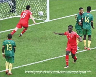  ?? (AFP) ?? Switzerlan­d’s forward Breel Embolo (third right) celebrates scoring against Cameroon during the World Cup Group G match at the Al Janoub Stadium in Al Wakrah yesterday.