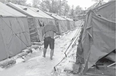  ?? — Gambar AFP ?? GAMBAR fail serahan Refugee Action Coalition pada 18 Februari, 2014 menunjukka­n keadaan di sekitar pusat pemprosesa­n wilayah Australia di Pulau Manus, Papua New Guinea.