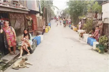  ?? ?? Barangays in Bacolod City experienci­ng a water shortage rely on rationing. The city government, along with key stakeholde­rs, agreed to promptly commence tapping Bocal-Bocal Spring, which is expected to provide five million liters per day of water.