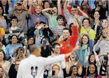  ?? Sara D. Davis / Getty Images ?? President Obama greets students at the University of North Carolina in Chapel Hill as he reaches out to young voters.