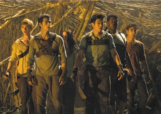  ?? 20th Century Fox ?? Newt (Thomas Brodie-Sangster, left), Thomas (Dylan O’Brien), Teresa (Kaya Scodelario), Minho (Ki Hong Lee), Frypan (Dexter Darden), andWinston (Alex Flores) in “The Maze Runner,” a teens-in-peril movie based on a best-selling series.