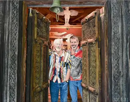  ?? Photos by Will Waldron / Times Union ?? John Sowle, left, and Steven Patterson stand in the doorway of their hexagonal home on Thursday, May 26, 2022, in Catskill. Sowle and Patterson founded Bridge Street Theater in 2013.