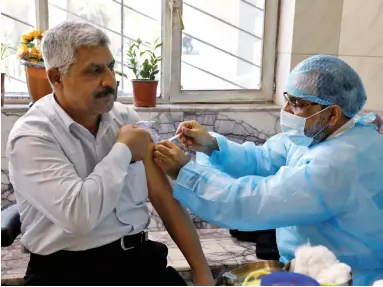  ?? ?? A man receives a vaccine against the coronaviru­s disease (COVID-19) in Baghdad, Iraq March 2, 2021.