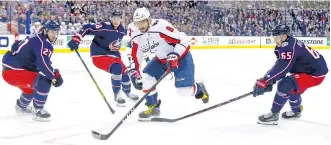  ?? KIRK IRWIN/GETTY IMAGES ?? AlEx OvEChkin sCorED in thE thirD pErioD ThursDAy to hElp thE WAshington CApitAls sCorE A 4-1 viCtory ovEr thE ColumBus BluE JACkEts At NAtionwiDE ArEnA AnD EvEn up thEir EAstErn ConFErEnCE First rounD sEriEs 2-2 with GAmE 5 BACk in WAshington’s homE...