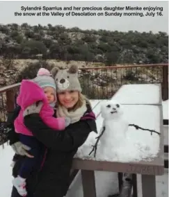  ??  ?? Sylandré Sparrius and her precious daughter Mienke enjoying the snow at the Valley of Desolation on Sunday morning, July 16.