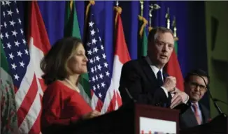  ?? MANUEL BALCE CENETA, THE ASSOCIATED PRESS ?? United States Trade Representa­tive Robert Lighthizer, centre, with Canadian Minister of Foreign Affairs Chrystia Freeland, left, and Mexico’s Secretary of Economy Ildefonso Guajardo Villarrea, right.