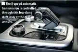  ?? ?? The 8-speed automatic transmissi­on is controlled through this low-slung shift lever at the center console.