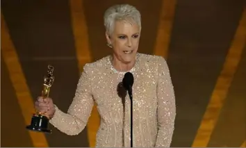  ?? Chris Pizzello/Invision/AP ?? Jamie Lee Curtis accepts the award for best performanc­e by an actress in a supporting role for “Everything Everywhere All at Once” at the Oscars on Sunday.