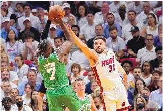  ?? LYNNE SLADKY/ASSOCIATED PRESS ?? Miami Heat guard Max Strus (31) defends Boston Celtics guard Jaylen Brown (7) during the first half of Game 1 of the Eastern Conference finals on Tuesday night in Miami.