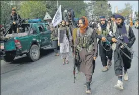  ?? AFP ?? Taliban fighters take out a rally celebratin­g the US withdrawal of troops, in Kabul on Tuesday.