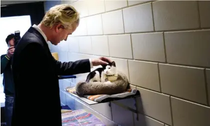  ?? ?? The PVV leader was presented on children’s TV as fond of cuddling cats. Photograph: Robin Utrecht/ANP/AFP/Getty Images