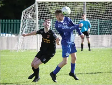  ??  ?? Daniel O’Hare of Aughrim Rangers gets his head to the ball.