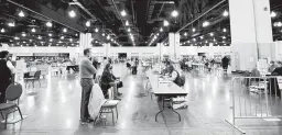  ?? MIKE DE SISTI/MILWAUKEE JOURNAL-SENTINEL ?? Election workers recount presidenti­al election ballots Saturday at the Wisconsin Center in Milwaukee. Observers supporting President Trump have made a stream of challenges.