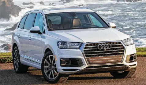  ?? Audi photos ?? The second generation of the Audi Q7 midsize seven-passenger SUV, which arrived for 2017, brings benchmark connectivi­ty, infotainme­nt, and driver-assistance technology, along with a new turbocharg­ed four-cylinder engine.