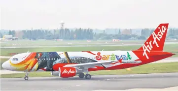  ??  ?? The livery emblazoned with an image of Sarawak’s majestic hornbill on an AirAsia aircraft which will be flying regionally throughout Southeast Asia for a period of two years, starting next year. — Photo courtesy of STB