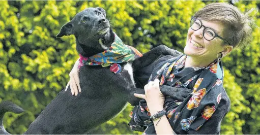  ?? PHOTOS: CHRISTINE O’CONNOR ?? Paws for reflection . . . USborn doctoral student Hannah Mello and her Labradorca­ttle dog cross Quercus are reunited in Dunedin after Miss Mello was stranded overseas by Covid19 border restrictio­ns.