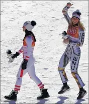  ?? Charlie Riedel Associated Press ?? LEDECKA, right, and silver medalist Anna Veith of Austria. It turns out she’s also skilled at windsurfin­g.