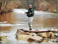  ?? TOM TATUM — FOR DIGITAL FIRST MEDIA ?? Opening day fisherman Jose Salazar of Downingtow­n tries his luck in the roiling waters of the Brandywine Creek.