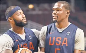  ?? DAVID BANKS, USA TODAY SPORTS ?? “I’m really pleased with our great camaraderi­e,” says Kevin Durant, right, with DeMarcus Cousins at practice.