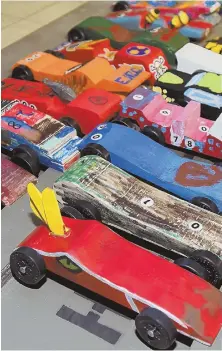  ??  ?? CAR-RIED AWAY: Cub Scout Pinewood Derby has colorful entries at Chelmsford’s Central Congregati­onal Church.