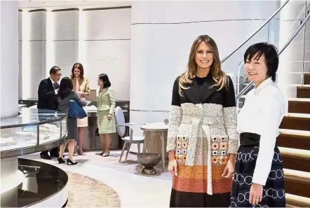  ?? — AP ?? Smile for the camera: Melania and Akie posing for a photo upon arrival at Mikimoto Ginza Main Store, Japan’s pearl jewellery maker, at Ginza shopping district in Tokyo.