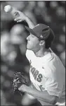  ?? AP/NATI HARNIK ?? Florida pitcher Alex Faedo held TCU to 2 hits and struck out 11 in 7 innings in the Gators’ 3-0 victory Sunday night.