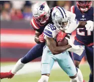  ?? Steven Senne / Associated Press ?? Cowboys wide receiver CeeDee Lamb (88) tries to break free from Patriots free safety Devin McCourty in Sunday’s game in Foxborough, Mass.