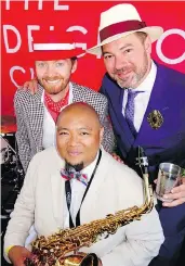  ??  ?? Deighton Cup co-founders Jordan Kallman and Tyson Villeneuve backed Arturo Fermill, a.k.a. Buddha Sax, at the event’s 10th-annual running.