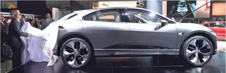  ??  ?? The Jaguar electric I-Pace concept car is unveiled to the news media Wednesday in Los Angeles. Jaguar officials say the I-Pace concept is not likely to be a direct competitor of Tesla Model X because it’s a class-size smaller. FREDERIC J. BROWN,...