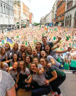  ??  ?? MAIN: Ayeisha McFerran takes a selfie including the whole team and the crowds on Dame Street. Photo: Sportsfile