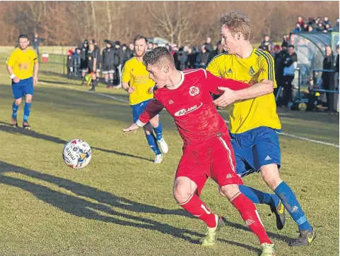  ??  ?? Sam Simpson grabbed a double last week as Carnoustie (red) beat Arthurlie in the Scottish Cup at Laing Park.