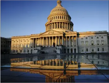  ?? J. SCOTT APPLEWHITE — THE ASSOCIATED PRESS FILE ?? In this Jan. 21, file photo, the Capitol is seen at sunrise in Washington.