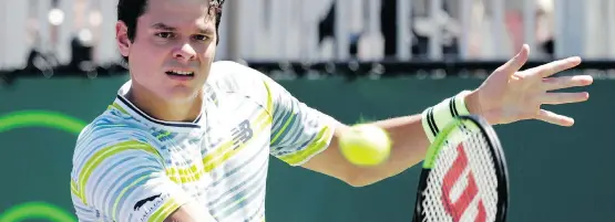  ?? LYNNE SLADKY/THE ASSOCIATED PRESS ?? Milos Raonic returns to Sweden’s Mikael Ymer en route to winning in straight sets in second-round action at the Miami Open Friday in Key Biscayne.