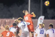  ?? ROBERTO E. ROSALES/JOURNAL ?? Lobo Matthew Constant, top, tries to head the ball into the goal during a game in Septermber 2017 against the University of Kentucky at UNM Track and Soccer Complex.