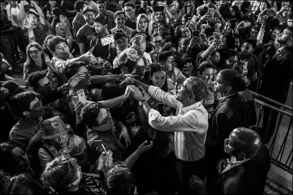  ?? JOE BUGLEWICZ / THE NEW YORK TIMES ?? Former President Barack Obama greets crowds Oct. 22 after speaking at a rally at Cox Pavilion on the UNLV Campus. While Obama’s speeches this election cycle have largely stuck with his trademark themes of idealism and hope, some of his supporters wonder if they’re witnessing a living time capsule from a bygone era of civil political rhetoric.