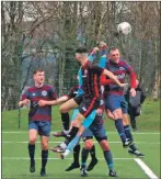  ?? Photograph: Chris Sanderson ?? Aaron Moore, right, and Star keeper Leon Murphy jump to clear the danger.