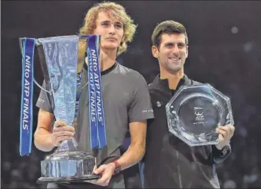  ?? AP ?? Alexander Zverev (left) beat Novak Djokovic 64, 63 to win the ATP Finals in London on Sunday.