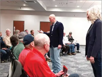  ?? Donnis Hueftle-Bullock ?? Above, U.S. Senator Pete Ricketts, center, and Dist. 43 Legislativ­e Candidate Tanya Storer, right, greet people at Monday evening’s “Get Out the Vote” Rally at the One Box Convention Center in Broken Bow. Above left: Senator Ricketts and Tanya Storer pause for a photo after answering questions Monday evening. At left are Dave Downey, Tanya Storer, Barb Cooksley and Bryan Trimble at Monday’s rally.