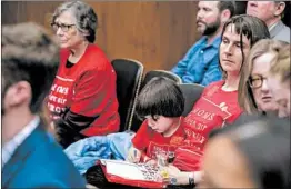  ?? ANDREW HARNIK/AP ?? Members of the audience wear shirts identifyin­g themselves as being part of Moms Clean Air Force as EPA Administra­tor Scott Pruitt testifies before a Senate panel.