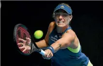  ?? QUINN ROONEY/GETTY IMAGES ?? Germany’s Angelique Kerber plays a backhand during her quarterfin­al destructio­n of American Madison Keys.