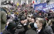  ?? Kent Nishimura Los Angeles Times ?? TRUMP backers gather outside the Capitol on Jan. 6. That day’s riot weakened the president’s standing.