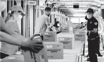  ??  ?? CONNECTICU­T AREA RESIDENTS CASH IN: Pictured above and watched closely by guards are protected U.S. Coin Packages containing the valuable unsearched Vault Bags that everyone will be trying to get. It’s hard to tell how much these unsearched bags loaded with rarely seen U.S. Gov’t issued coins could be worth someday. That’s because each Vault Bag is known to contain nearly 3 pounds of U.S. Gov’t issued coins some dating back to the early 1800’s, so you better believe at just $980 these Unsearched Vault Bags are a real steal.