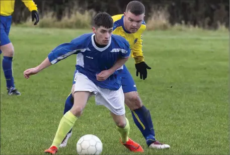  ??  ?? Glenview Stars’ Dylan Martin in action with Paul Logan of Manorhamil­ton Rangers in Forthill on Sunday. Pics: Donal Hackett.